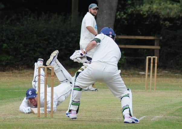 Andrew Smith just makes his ground on his way to an unbeaten 40 for Rowington 2nds.