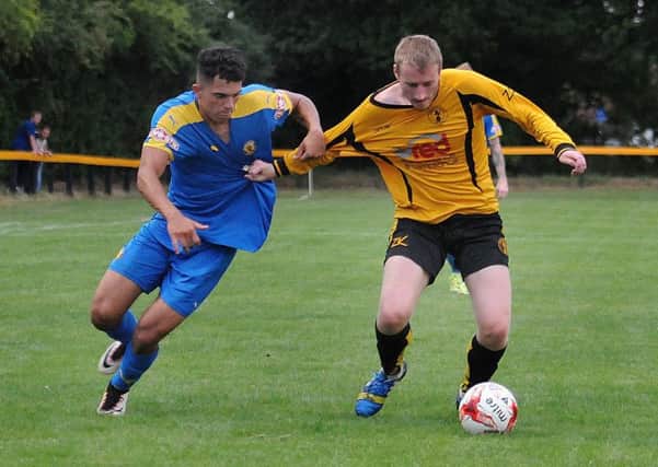 Kurtis Revan and Louis Bridges get to grips with each other during Racing Club Warwick's friendly with Leamington. Picture: Morris Troughton