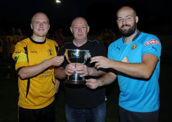 Robert Horley presents the Tony Horley Charity Cup to Racing Club skipper Alex Price and Brakes captain Tony Breeden.