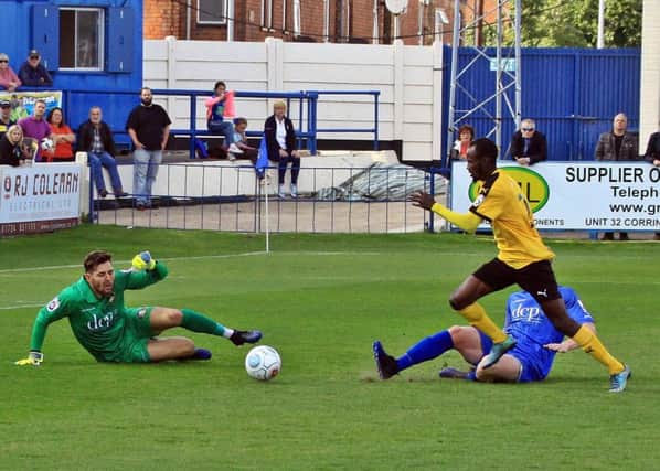 Ahmed Obeng evades a last-ditch challenge on his way to rounding Richard Walton and scoring Leamington's winner. Pictures: Sally Ellis