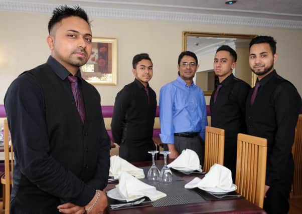 The Millenium Balti, Bath Street, Leamington Spa, has recently been awarded winner, of the Leamington Courier Curry House of the Year.

Pictured: Mohammed Ahad together with his Staff. NNL-160621-235955009