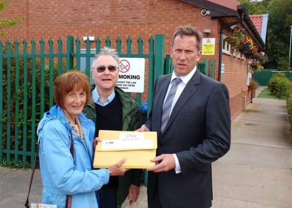 Norma Timms, North Warwickshire KONP, Martin Drew, South Warwickshire KONP, handing the petition to Andy Hardy, CEO of University Hospital Coventry and Warwickshire (UHCW) & Lead of the Coventry and Warwickshire Sustainability and Transformation Plan (STP) Board at a Healthwatch Warwickshire forum, Wolston Community Centre.
