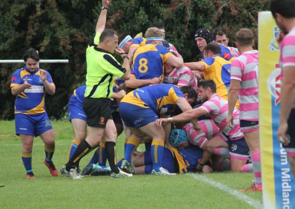 Bobby Thompson touches down under a host of bodies for Kenilworth's opening try.