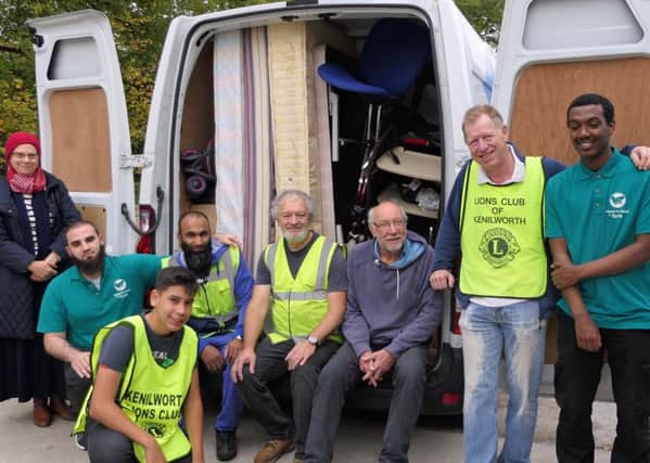 Volunteers from Kenilworth Lions and Hand in Hand for Syria loading the van with donations