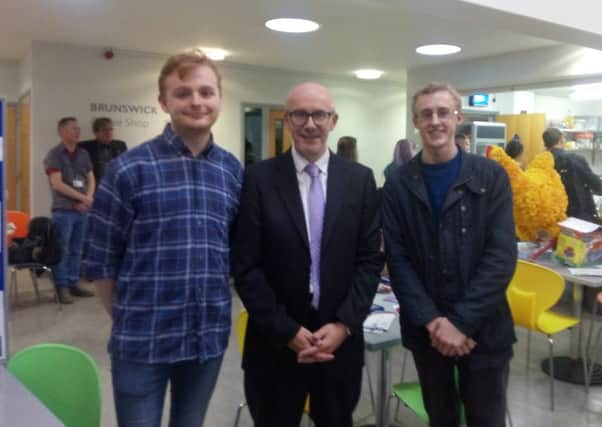 Warwick University graduates Liam Jackson (left) and Felix Ling (right) at the Warwick University Students' Union welcome event with Warwick and Leamington MP Matt Western.