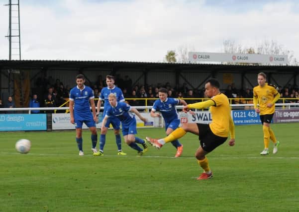Rob Thompson-Brown fires home his second spot-kick of the afternoon. Picture: Morris Troughton
