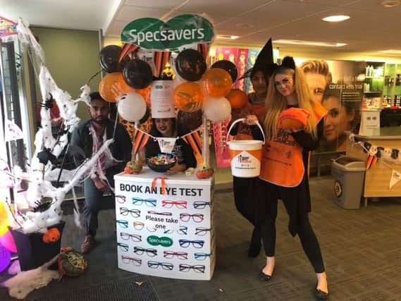 Specsavers staff in Halloween fancy dress raising money for Stand Up To Cancer