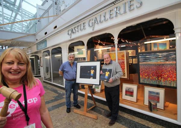Di Yeoman, media and marketing officer for Heart of England Mencap with auction organiser George Anderton (back left) and Jason Lawson, Manager of Castle Galleries.