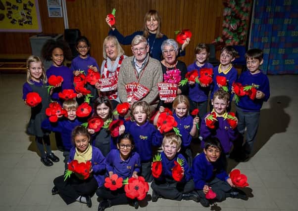 Pupils and Staff from Briar Hill Infant School, have recently handed over more than 100 handmade poppies, to committee members of the Warwick Poppies 2018 project at St. Mary's Church. NNL-171121-231512009
